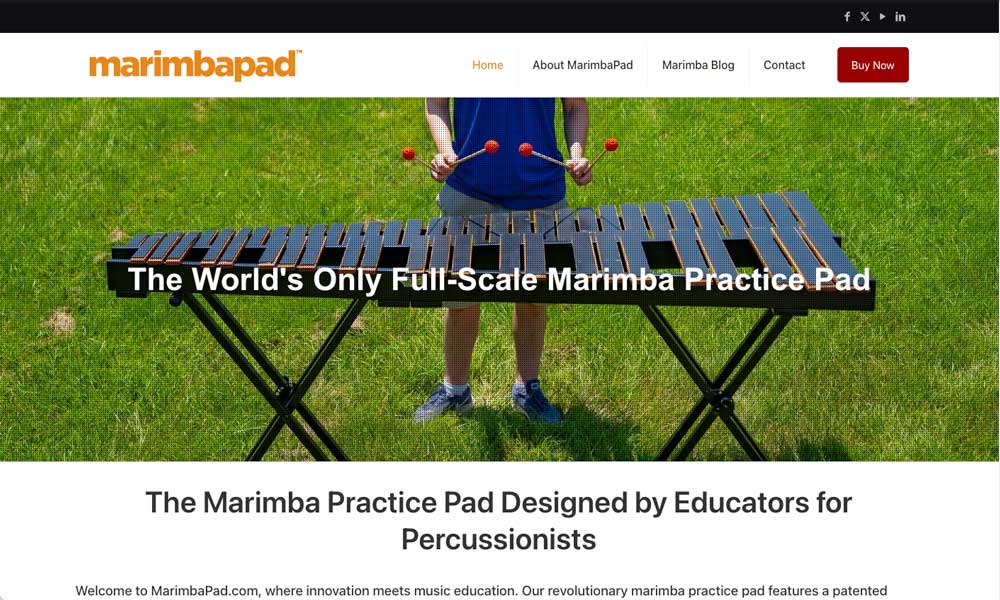 MarimbaPad homepage with an orange wordmark and a photo of a musician playing the practice pad outdoors on grass, captioned “The World's Only Full-Scale Marimba Practice Pad”